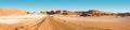 Road and salt formations at Ã¢â¬ÅValle de la LunaÃ¢â¬Â in San Pedro de Atacama Royalty Free Stock Photo